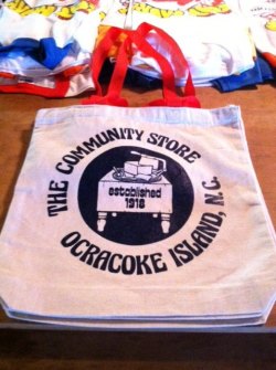 Tote bags display the store logo.